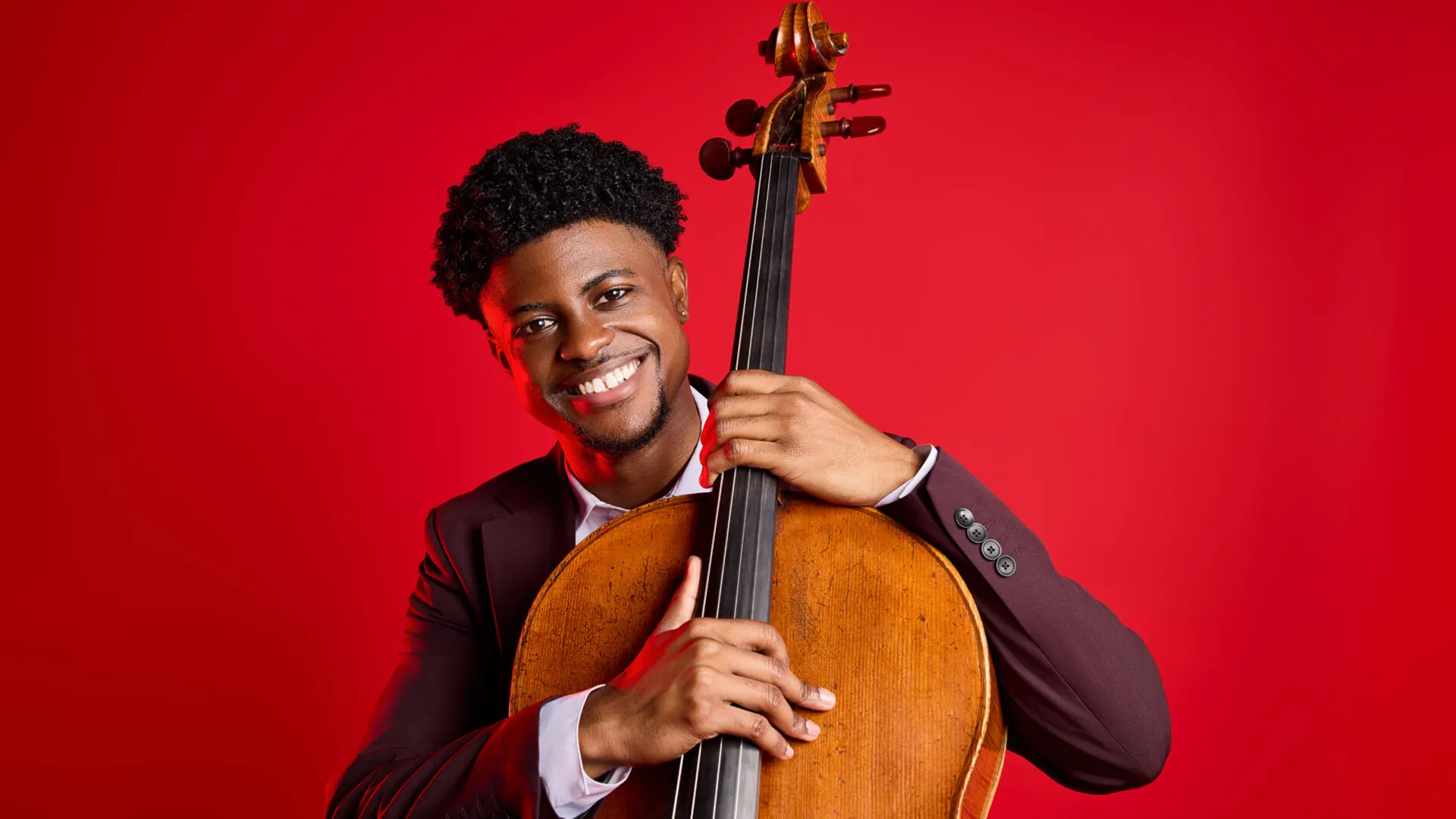 Sterling Elliott, holding his cello